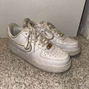 White and Gold Air Force 1 sneakers